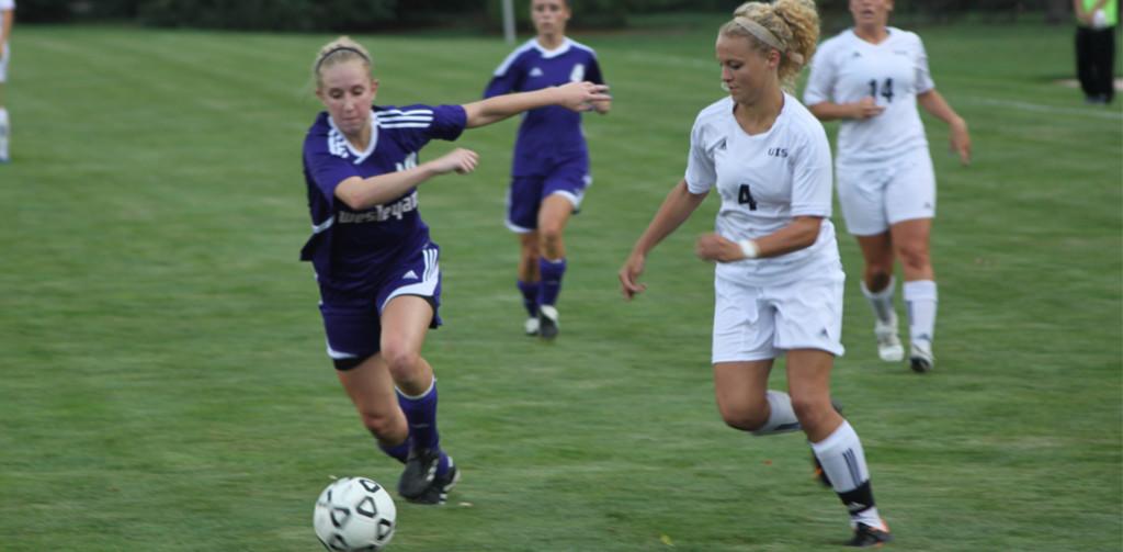 Sophomore forward Carin Fearing fights for possession of the ball against a Kentucky Wesleyan defender. 