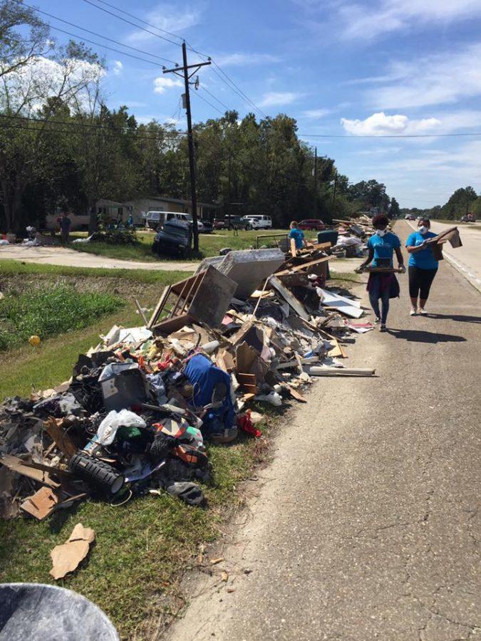 Students help clear wreckage from the Baton Rouge area.