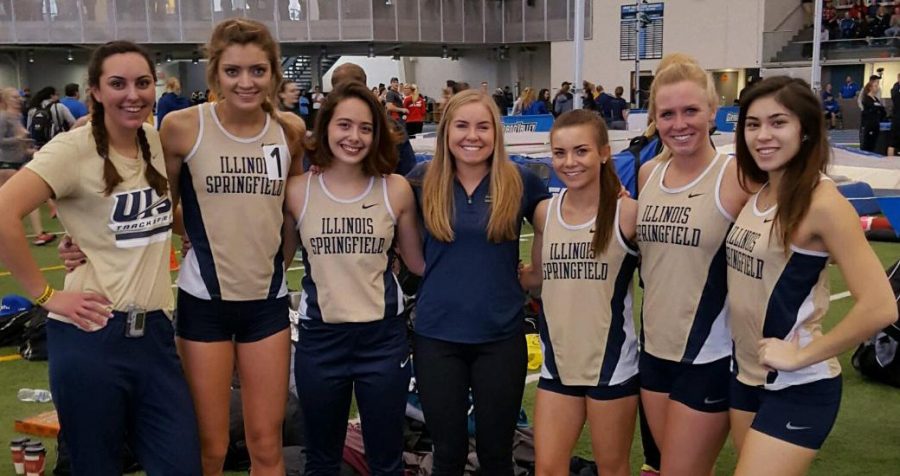 UIS track and field teammates pose at a meet. Courtesy of UIS Athletics