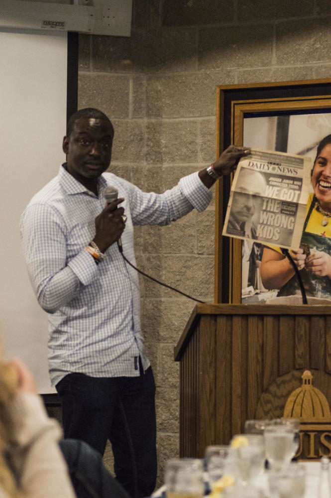 Salaam shows a front page from after his exoneration