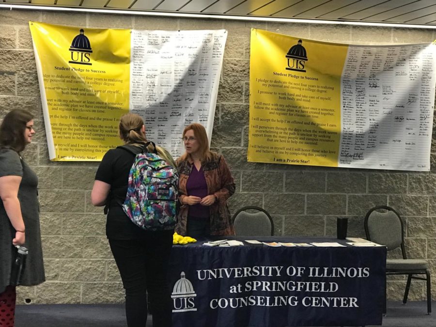 Gebhardt talks to students by the Food Emporium