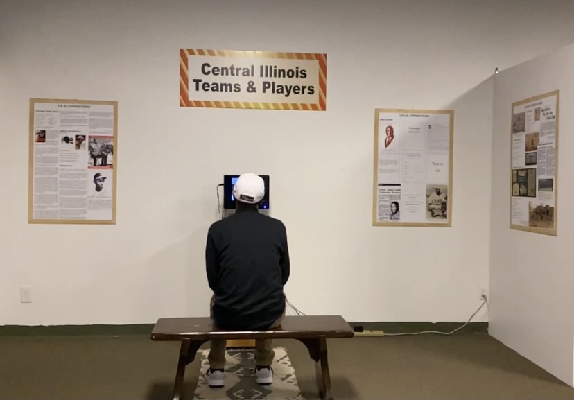 A+museum+goer+sitting+on+the+bench+watching+a+program+at+the+Springfield+and+Central+Illinois+African+American+History+Museum+%7C+Photo+credit%3A+Richard+Bailey