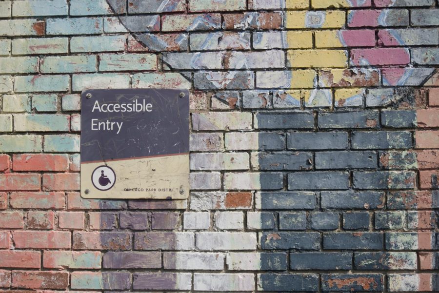 A sign that says Accessible Entry. | Photo Credit: Photo by Daniel Ali on Unsplash
