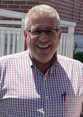 An image of Darren Bailey smiling against a brick building. | Photo Credit: Wikipedia Commons