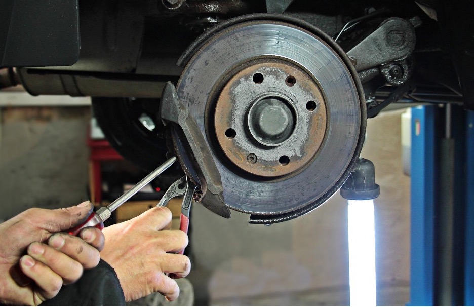 An automotive technician working on a car |Photo Credit: S. Hermann / F. Richter from Pixabay 