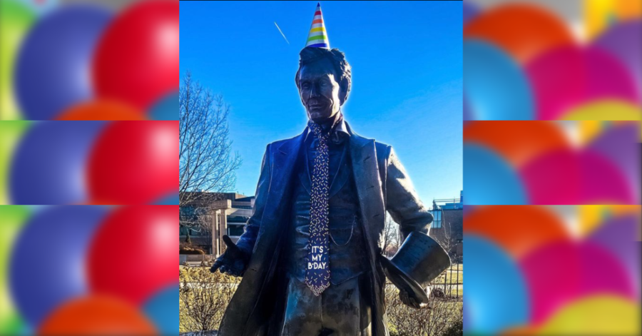 Abraham Lincoln statue on the UIS campus sporting a birthday tie and party hat | Photo credit: UIS