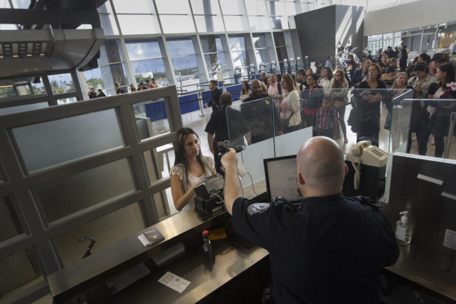 U.S. Customs and Border Protection, Office of Field Operations, officers conduct standard arrival screening operations at Miami International Airport in Miami, Florida, Jan. 10, 2018. U.S. Customs and Border Protection photo by Glenn Fawcett via Wikimedia commons.
