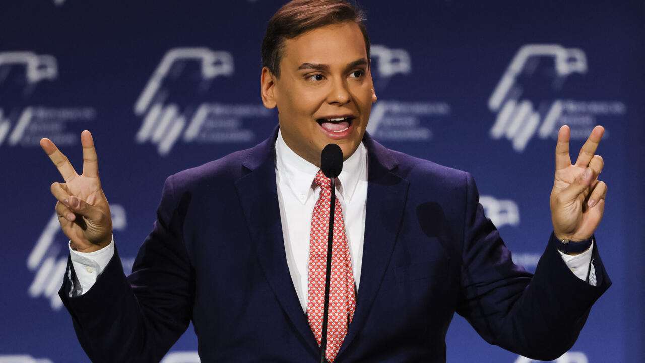 Congressman George Santos (R – New York) holding up peace signs | Photo credit: Archyde.com