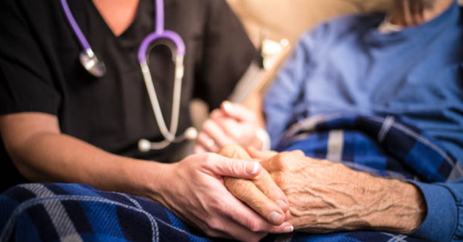A+Hospice+Nurse+and+An+Elderly+Patient+%7C+Photo+credit%3A+LPETTET+via+Istock+
