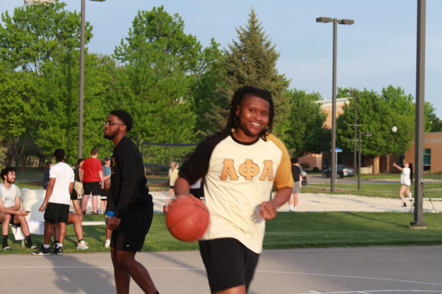 UIS Student running with the basketball at the Block Party | Photo Credit: Bwayisak Tanko