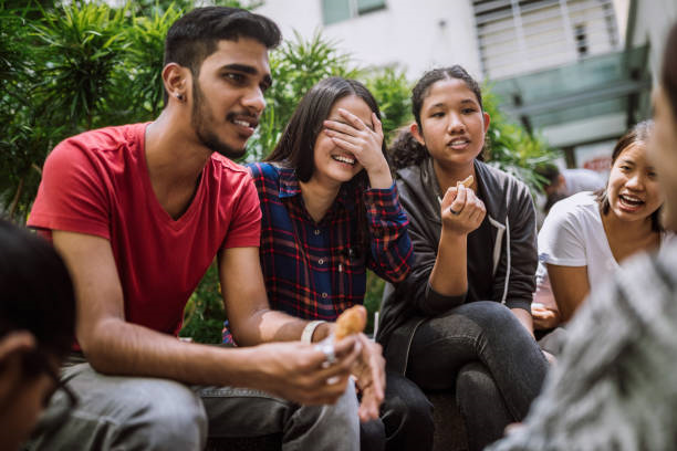 Multi Ethnic Group Of Students Joking And Getting To Know Each Other Better On Lunch Break in University Yard |
Photo Credit: https://www.istockphoto.com/portfolio/Pekic?mediatype=photography
