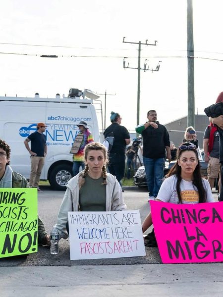Protesters demonstrate with signs outside of an ICE detention facility in Broadview, Illinois, September 12th, 2025. Demerike Palacek (right) is a hispanic veteran and one of several congressional candidates who have been directly involved in protesting Operation Midway Blitz. Photo by Paul Goyette