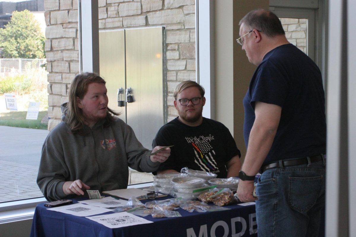 Members of the UIS Model United Nations team sell baked goods at the Student Union to support travel to the National Model United Nations conference in New York City.
