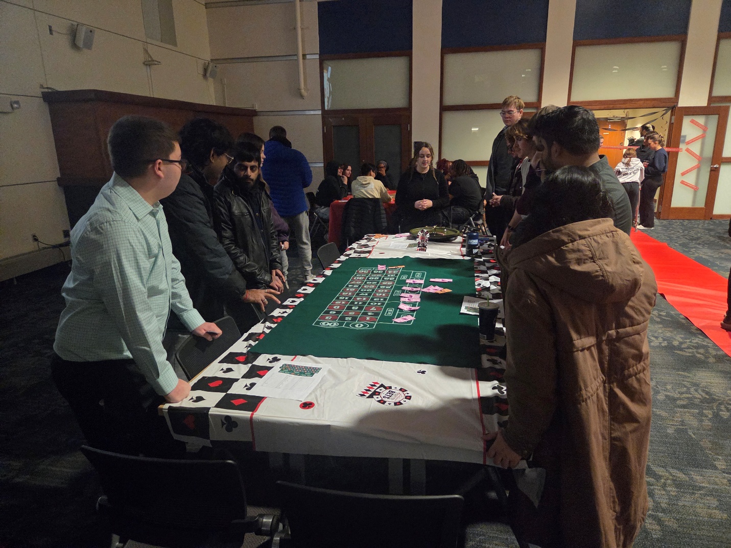 Students bet fake money on Roulette at Casino Night.