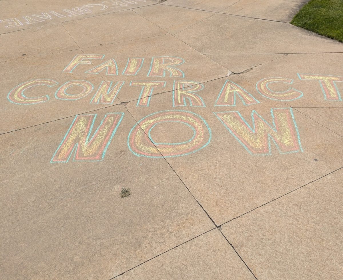 A message written in chalk by striking faculty on the sidewalk near the quad that reads: “Fair Contract Now.”