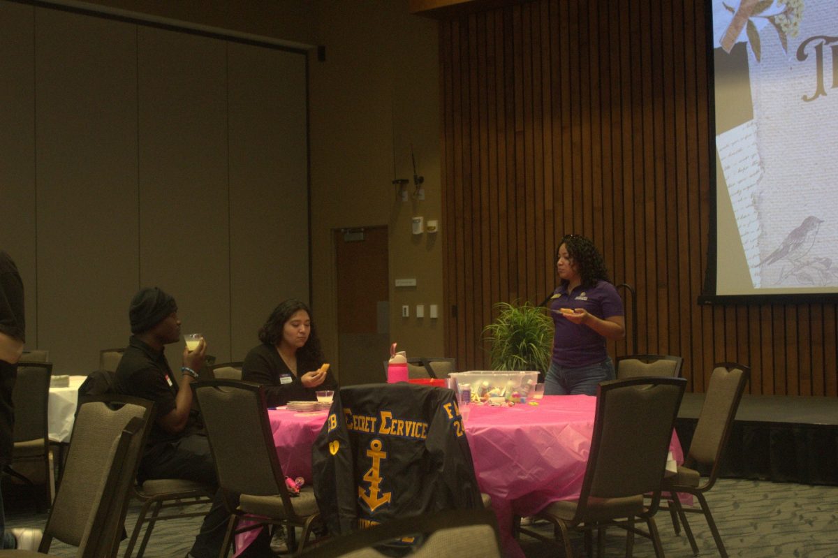 Students enjoying free snacks at the UIS Gender and Sexuality Student Services Transcending the Media event on April 3. 