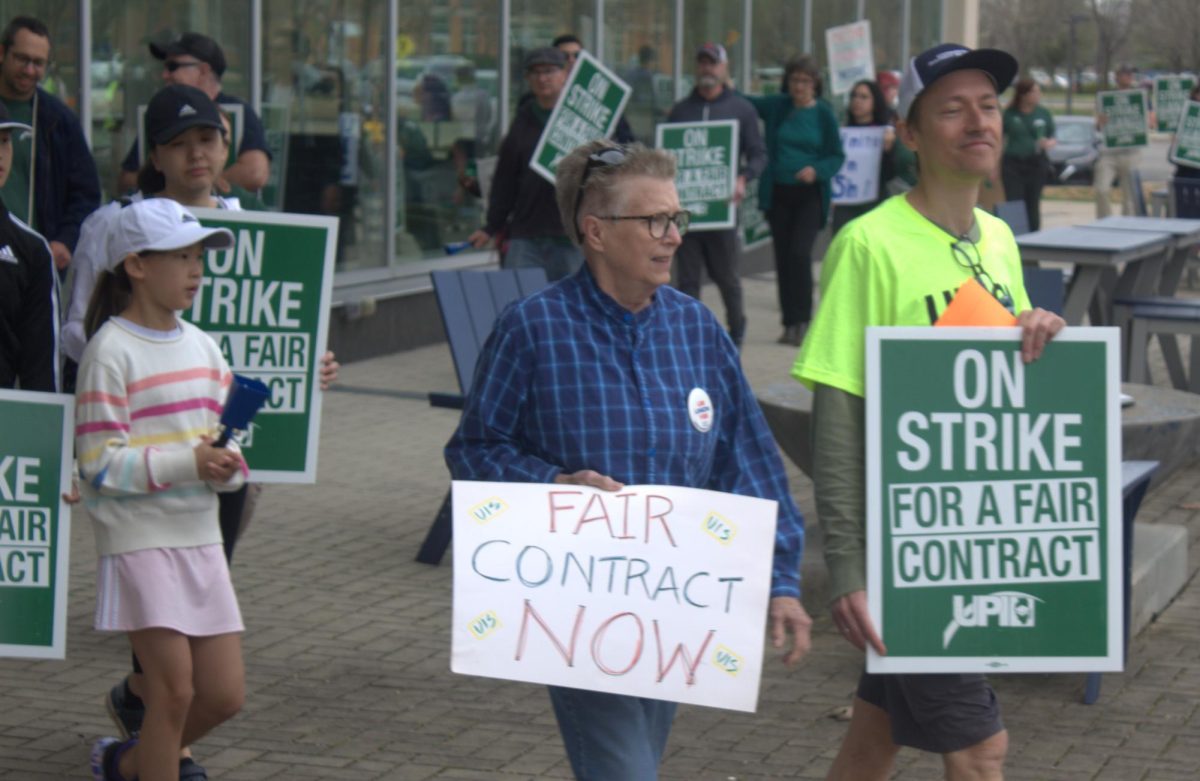Professors and other union supports march in front of the UIS Student Union during the first day of their strike on Friday, April 3, 2026.